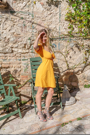 Mila Amour Pulls An Orange Dress Off On A Stone Terrace - Photo 00