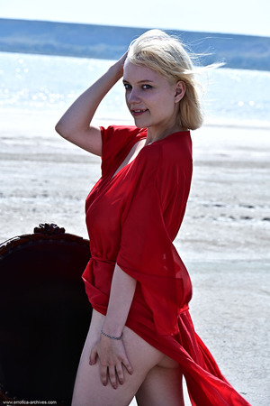 Raquel Drops A Red Robe On The Windy Sand - Photo 00