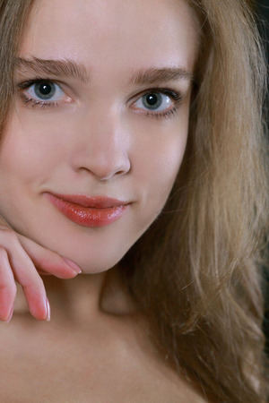 Xenia Slips Off Red Panties And Spreads On A Dark Couch - Photo 00