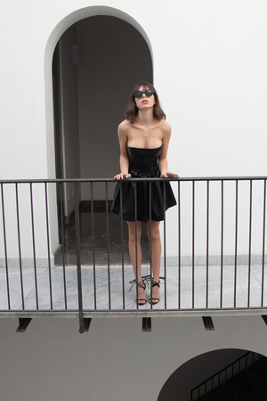 Linda Strips A Black Dress Bare By The Window - Photo 00